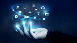 Hand holding digital media icons in blue glow.